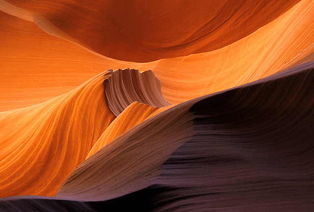 The swirling stone of a slot canyon mimics a stormy sea.