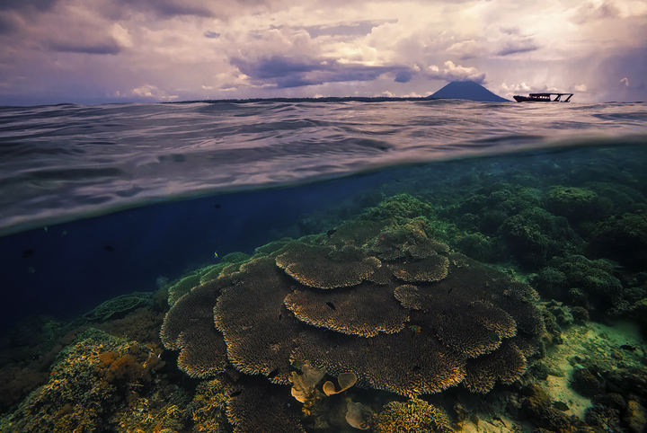 Calypso A view below the surface as a tropical squall blows across the pristine waters near Bunaken island.