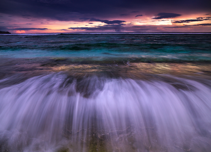Delicate Tides The tide flows in and pastel clouds recede to the horizon. Ofu beach in the National Park of American Samoa. The least visited...