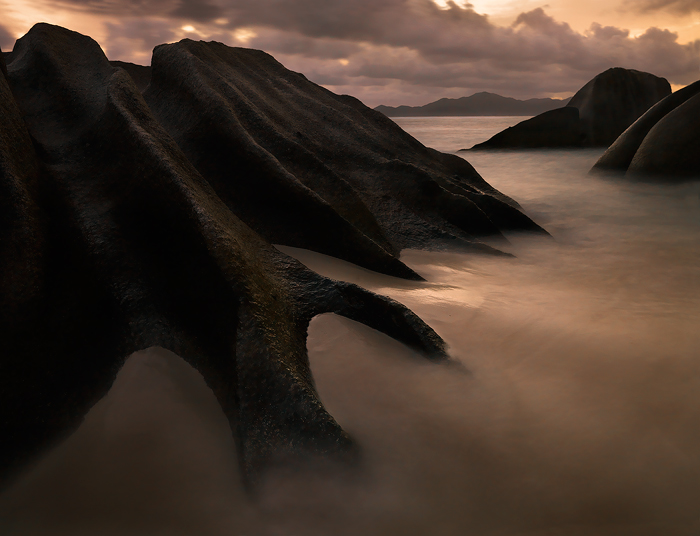 Twilight on the prehistoric boulders of La Digue Island, Seychelles.