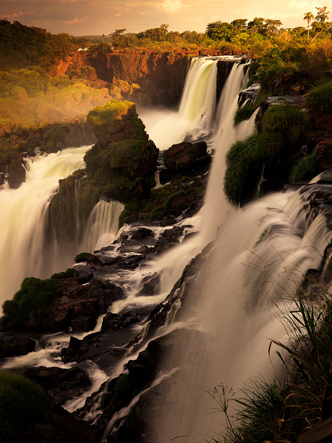La Catarata The magnificent Iguazu falls shining in the last light of the day.