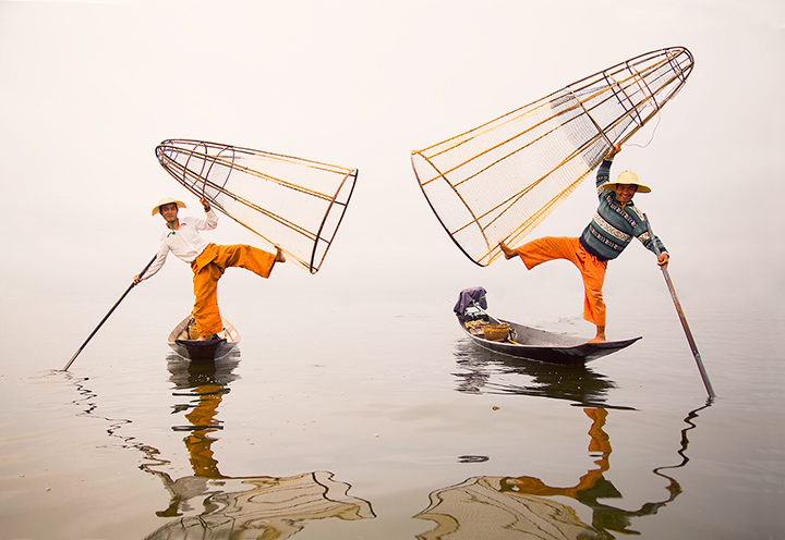 Inle Lake's traditional Intha Fishermen play around in front of my camera as the morning mist envelopes the lake.&nbsp; They...