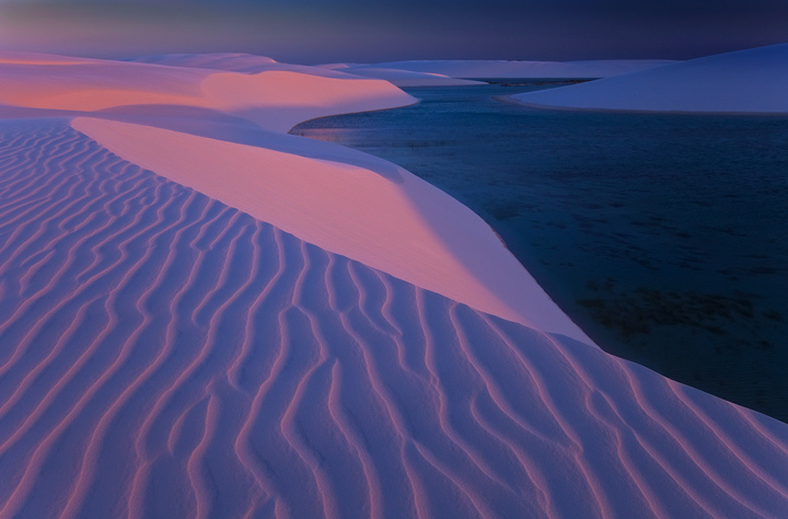 Pink Sands The pastel colors of twilight are absorbed by the soft white sands of the dunes. I almost forgot to mention the killer birds...