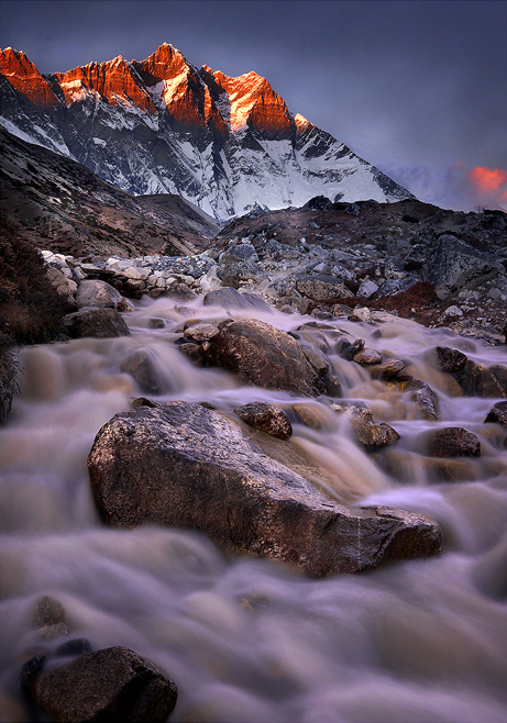 Lhotse Falls A cascade below Lhotse peak and the tallest rock wall in the world. Along the route to Island Peak Base Camp, Nepal.