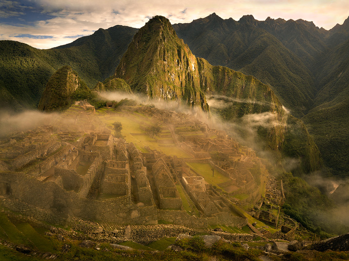 The warm rays of sunrise begin to burn off the morning fog over the lost city of Machu Picchu.&nbsp; I was lucky enough to be...