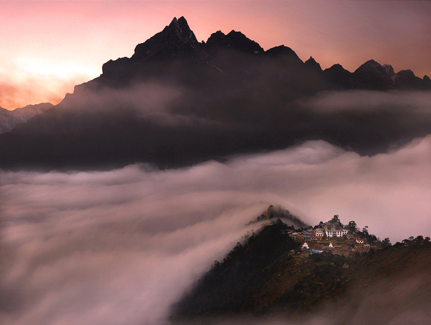 The famous Tengboche Monastery floats over heavenly clouds under the shadow of Mt Everest. The monastery has been there for centuries...