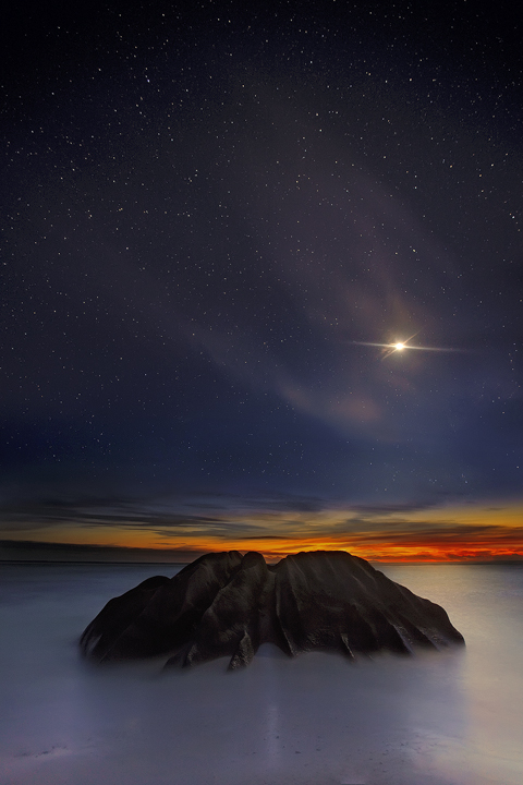 The moon&nbsp;falls through a veil of high clouds as twilight turns to stars.&nbsp;&nbsp; This is a blend of two images taken...