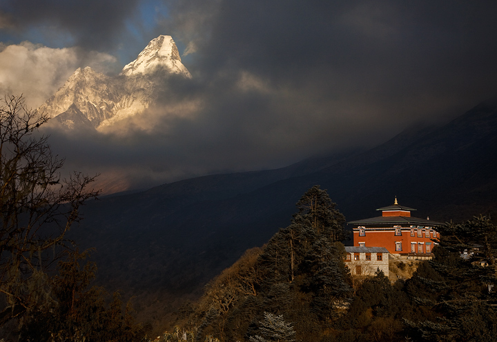 Late afternoon light begins to reveal the icy world beyond Tengboche Monastery. Nepal Himalaya.