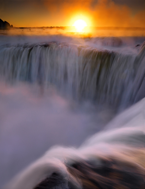 Sunrise through the morning mist of&nbsp;Iguazu falls. I was extremely lucky to get this image. The park doesn't open to visitors...